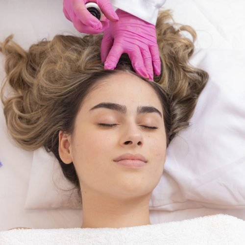 patient undergoing treatment to grow hair in a beauty clinic. hair growth treatment